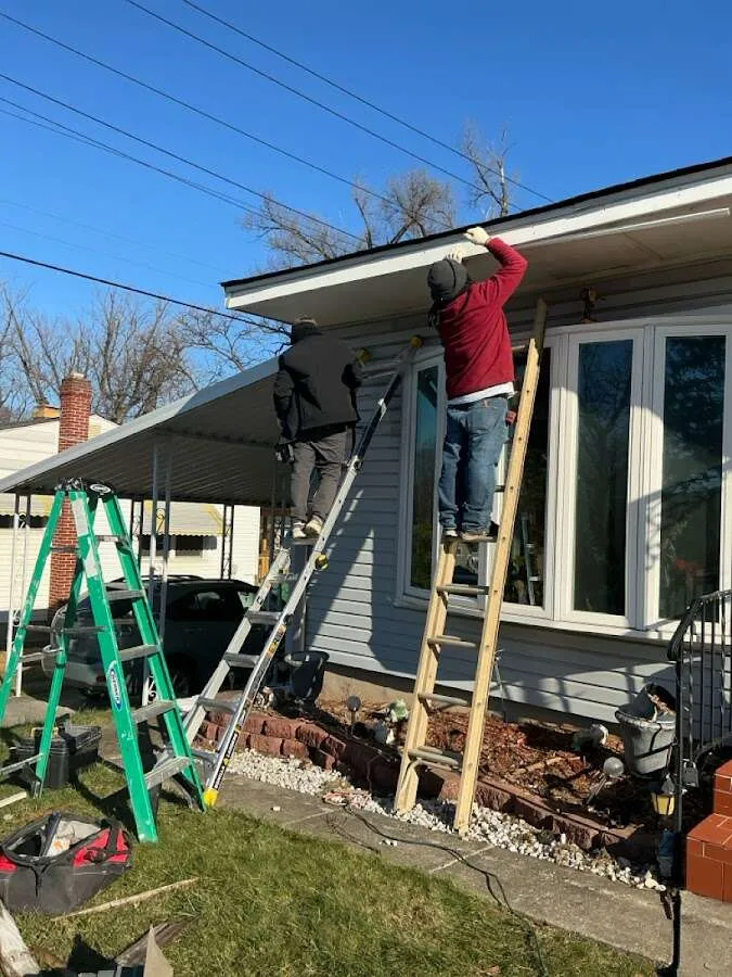 Restoration crew performing exterior repair in Philipstown